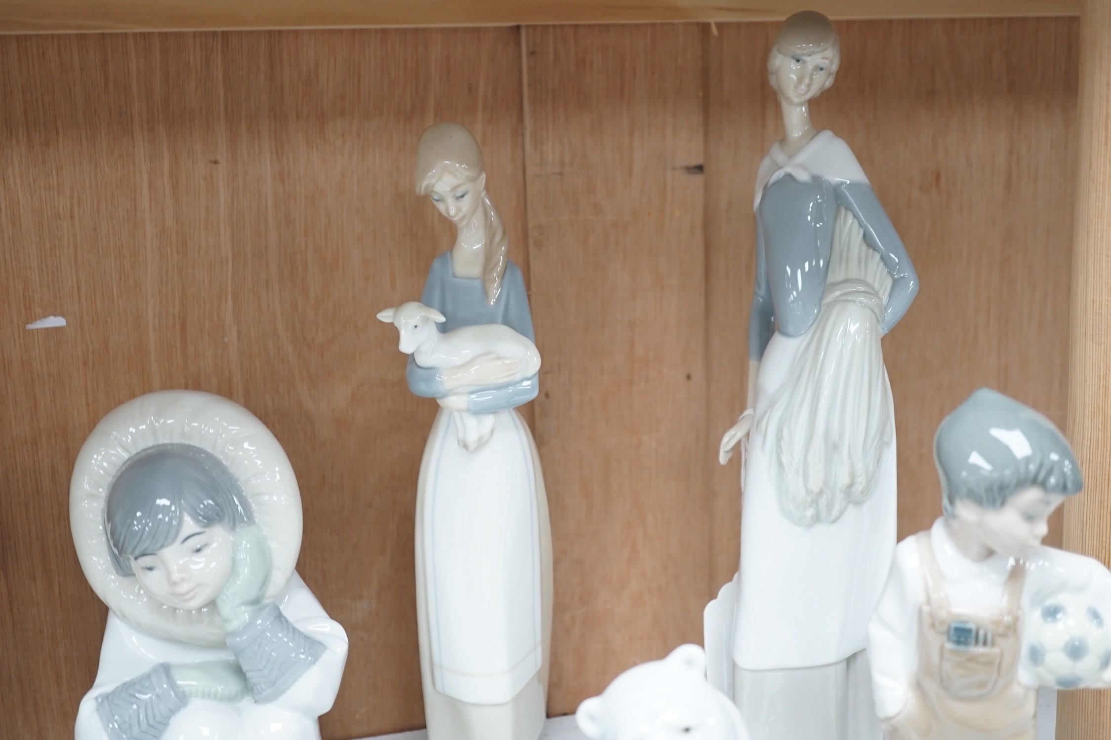 Lladro figurines, models of ducks and six Nao figurines and ducks and an unmarked model of ducks